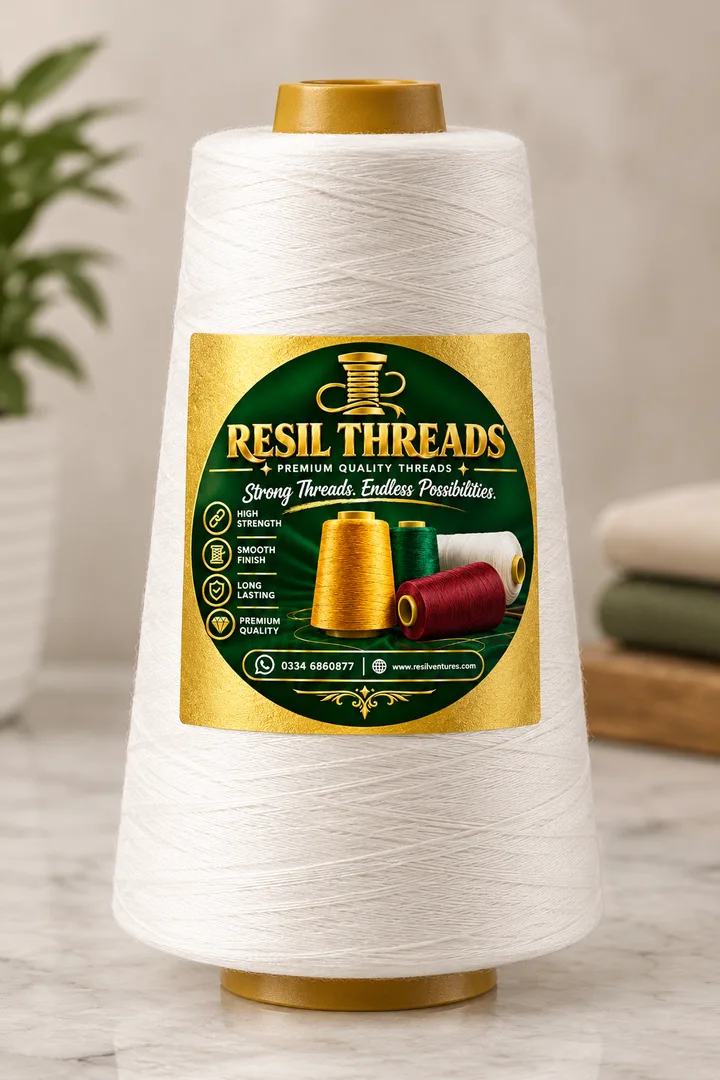 A cone of natural white cotton thread with the Resil Threads label